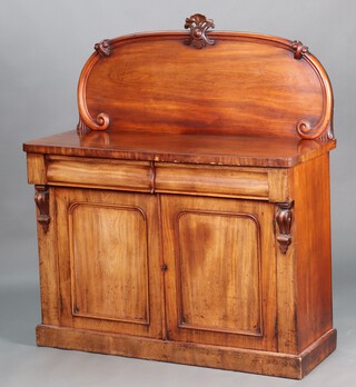 A Victorian bleached mahogany chiffonier with arch shaped back, fitted 2 drawers above a double cupboard enclosed by panelled doors, raised on a platform base 129cm h x 120cm w x 47cm d 