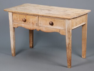 A Victorian bleached pine side table, the top of plank construction, fitted 2 drawers, raised on square  supports 77cm h x 124cm w x 65cm d 