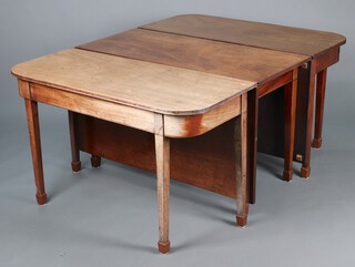 A Georgian mahogany drop flap D end extending dining table, raised on 12 square supports ending in spade feet 73cm h x 120cm w x 165cm when closed x 282cm when open 