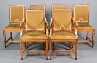 Gaylayde, a 1930's inlaid figured walnut dining suite comprising oval extending dining table with 1 extra leaf,  the edge with inlaid decoration, raised on square tapered supports 75cm h x 107cm wide x 142cm l x 182cm long when extended, 6 inlaid dining chairs - 4 standard chairs 88cm h x 48cm w x 41cm d and  2 carvers 90cm h x 52cm w x 45cm d upholstered in yellow material raised on square tapered supports with H framed stretchers and a matching sideboard with raised mirrored back fitted 2 drawers flanked by pair of cupboards, with ivory handles 125cm h x 168cm w x 58cm d  (This suite was a gift from the staff of Vokins Department Store in Hove to H Vokin on the occasion of his marriage) Ivory Exemption Certificate MYAJ1H9S