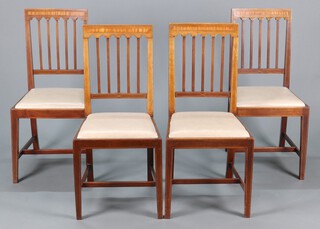 A set of 4 Edwardian inlaid mahogany stick and rail back dining chairs with upholstered drop in seats, raised on square tapered supports with H framed stretcher 94cm h x 45cm w x 43cm d 