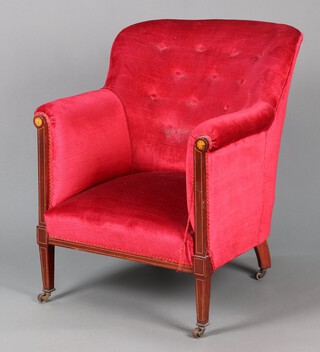 An Edwardian inlaid mahogany tub back chair upholstered in red material, raised on square supports with brass caps and casters 79cm h x 64cm w x 54cm d 