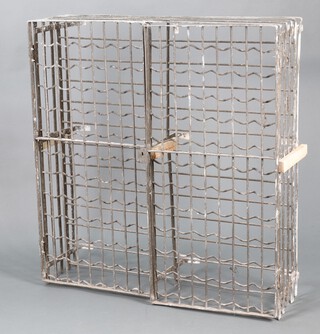 A wrought metal 132 bottle wine rack with railed metal doors 123cm h x 117cm w x 36cm d 