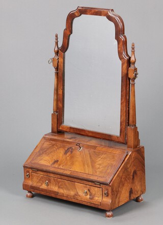A 1930's Queen Anne style arched plate dressing table mirror, the base in the form of a bureau with fall front revealing a fitted interior with pigeon holes and drawers above 1 long drawer, raised on bun feet 81cm h x 48cm w x 25cm d 