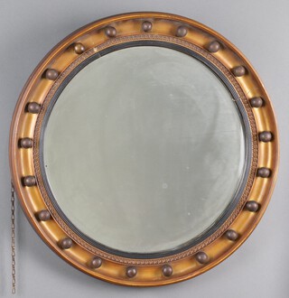 A Georgian style circular bevelled plate wall mirror contained in a ball studded frame 58cm 