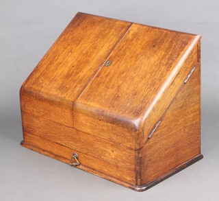 A Victorian light oak wedge shaped stationery box with stepped fitted interior, the base fitted a drawer 28cm h x 38cm w x 21cm d 