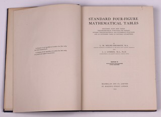 MILNE-THOMSON, L.M. and COMRIE, L.J.  Standard Four-Figure Mathematical Tables.  London: Macmillan and Co., Limited 1931.  4to, 245pp.  Original blue cloth with gilt lettered spine, Rubbing to corners and edges of spine, scratch marks to covers.  Additional loose double sided, un-numbered copy of pages 244 and 245.   Initialled B.N.W. Feb 1941 