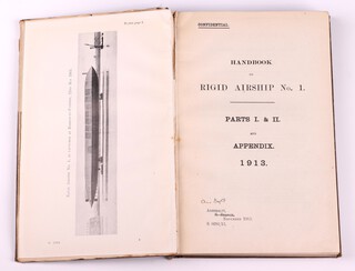 MASTERSON Commander E. A. R.N. Handbook on Rigid Airship No. 1 Parts I & II and Appendix 1913. Admiralty S Branch S.0281/13.  8vo., bound in blue tooled cloth, gilt title to spine, gilt "No.43" to top right front board. Fading to spine and cover, rubbing to corners and edges of spine, (spine detatched from front edge),   Errata list 1914 glued to front page, "S Branch" on title page crossed out and replaced "Air Dept."  Photos, diagrams and fold out coloured plates throughout.  Signed to pastedown B N Wallis and marked Shore Station Barrow in Furness 