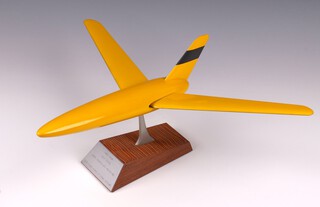 A yellow painted wooden model of the Wild Goose, raised on a wooden base with metal plaque stamped "1949-1954 Wild Goose, Wing-Controlled Aerodyne, 1/16 Scale Model Trials Aircraft" 15cm h x 47cm w x 35cm d.

Wild Goose was a late forties research project into tailless variable-sweep aircraft using a unmanned aerial vehicle (UAV). It was developed to explore the advantages of variable-geometry or swing-wing aircraft and eventually evolved into the Swallow.