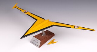 A yellow painted wooden model of the Vickers Swallow, raised on a wooden base with engraved metal plaque stamped "1954-1958 Swallow 1/16 Scale Model of Trials Aircraft" 14cm h x 65cm w x 30cm d.

The Vickers Swallow was the evolution from the Wild Goose toward creating a supersonic aircraft 
