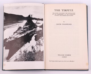 WOODWARD, David, The Tirpitz.  London: William Kimber. 8vo, 223pp.  Original blue cloth with gilt lettered spine.  Fading to spine and cover, minor rubbing to corners and edges of spine.  Second edition 1953.   Together with an envelope addressed to Dr Barnes with pencil notes to the reverse, a loose slip of paper with typed notes and a cut out section of the books dust cover, signed B.N. Wallis to half title page 
