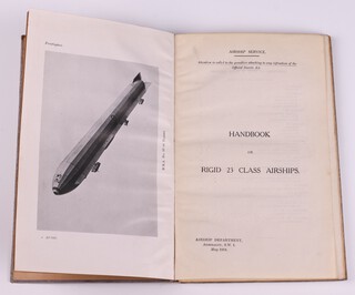 Handbook on Rigid 23 Class Airships 1918, Airship Department May 1918, 8vo, 86pp bound in blue cloth with debossed white text.  Fading to spine and cover, minor rubbing to corners and edges of spine.  Photos, diagrams and fold out coloured plates throughout.  Signed B.N.Wallis to endpaper and stamped 26.  Pastedown with glued confidential Government statement 
