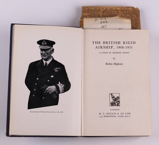 HIGHAM Robin, The British Rigid Airship 1908-1931, London: Foulis 1961, 8vo, 426 pp. Original blue cloth cover, silver lettering, fading to spine and cover, rubbing to corners and edges of spine, with fold out map to back board, appears to be a copy sent to Wallis for proof, Wallis' notes and corrections throughout on the text and on notepaper.  Long note taped on page 157 (Chapter titled Impact of Jutland and L33) of Wallis' actions around this time, index has pencil note informing which Airships he worked on with H.B. Pratt, also together with a newspaper cutting "Life in the raw on the R100 airship station" by Lady Barnes Wallis 