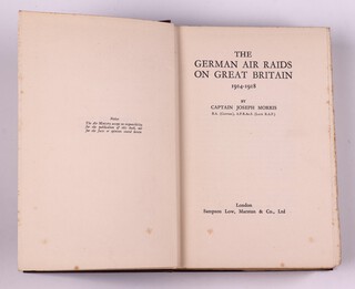 MORRIS, Captain Joseph.  The German Air Raids on Great Britain 1914-1918.  London: Sampson Low, Mason & Co., Ltd.  8vo, 306pp.  Original red cloth, gilt lettered spine.  Some fading to spine and cover, minor rubbing to corners and edges of the spine.  With fold out maps and illustrations.  Signed B.N. Wallis 