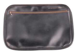 A black document case marked British Aircraft Corporation, with zipped main compartment and zipped compartment to the front 29cm h x 41cm w  (Sir Barnes Wallis worked for BAC from 1945 until he retired in 1971)