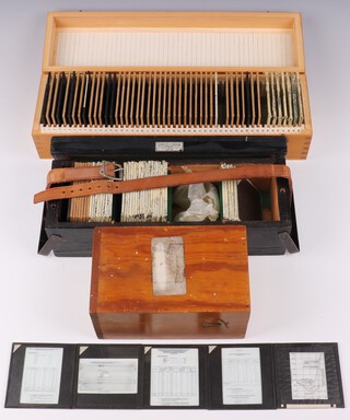 A collection of Barnes Wallis' lecture slides mainly about Radio telescopes and Wallis' Interests in fitted numbered wooden boxes (114 slides, in 3 boxes) 
Small Box R, Misc. Formulae, 25 slides 
Graphs, tables and photos showing the results of tests on duralumin, aluminium and other metals 

Box T, Miscellaneous, 48 slides
Slides 1-6 Microscopic cross-sections of materials. 
Slides 7-14 Manufacture of mystery cylinders. 
Slides 15-21 Radio telescopes, mainly photos, 1 design. 
Slides 22-29 Architecture: photo of the Pantheon, plans of church rooves and domes. 
Slides 30-34 Architecture: photos of a bridge, photo of a chiming clock. 
Slides 36-42 Miscellaneous. 
Slides 44-50 Lines of poetry and sayings. 

Box X, Personal (Sir Barnes Wallis), 39 slides 
Back group -  Five slides of old architecture. 
Middle group - 18 slides of ancient/old architecture. 
Front group - 10 slides of old/modern architecture and 18th century sailing ships. Three slides of architectural ground plans. Four slides of children's swings, slide, roundabout. Two other slides. 

