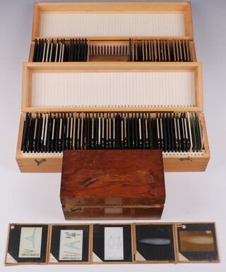 A collection of Barnes Wallis' lecture slides mainly about Airships and Aircraft in fitted numbered wooden boxes (106 slides, in 3 boxes)
Box H, mainly aircraft, 36 slides 
Slides 1-6 Geodetic structure, Aircraft wheel, viaduct architecture, miscellaneous 
Slides 8-10 Photos of cracks in materials 
Slides 12-17 Photos of aircraft, cutaways of Wellington to show structure 
Slides 19-21 Photos, seagull in flight, ballistics, jet engine 
Slides 35-43 Photos of prototype jet-propelled bomb? 
Slides 45-50 Photos of model aircraft and construction of stratospheric chamber 

Small Box O, 22 slides (5 slides cracked) 
Starting at piece of paper which says "Start Here"
7 world or regional maps, 1 table about trade, 3 photos of R100 (2 interior, 1 exterior; damaged), 2 tables and 6 photos related to flight testing (normal and hypersonic), 3 diagrams of swing-wing Swallow 

Box V, Airships, miscellaneous, 48 slides (1 slide broken) 
Slide 1 1919 drawing of Airship for England New Zealand travel 
Slide 2 Photo of mystery item (1920s?) 
Slides 4-30 Photos of manufacture of airship R100 (one drawing)
Slides 31-36 Photos of R100 in flight 
Slides 38-39 Drawings of 1919 airship 
Slides 40-42 b/w copies of paintings of 1919 in flight and mooring to ship 
Slides 43-45 Photos of cabins slung below airship (1920?) 
Slides 46-50 Miscellaneous 
