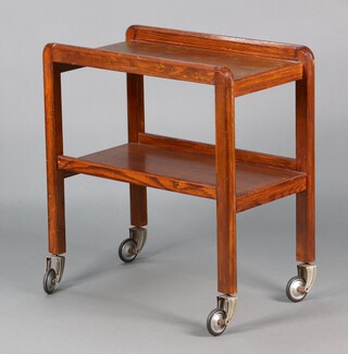 A 1930's rectangular oak 2 tier tea trolley with sprung and rubber wheels 73cm h x 69cm w x 39cm d 