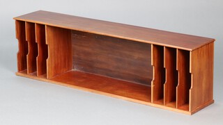 A 1930's mahogany and plywood filing rack, the centre fitted an aperture flanked by 6 compartments, 41cm h x 138cm w x 27cm d 