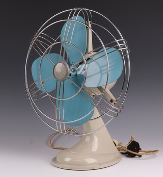 A Revo Aermaster, 4 bladed, metal electric oscillating table fan, base marked AERMASTER batch no. F207, with original flex and round pin fused plug 40cm h x 18cm w x 24cm d 