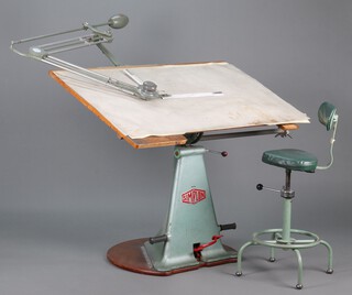 A grey Simplon draughting table/desk, c.1960s, fitted with a Mavitta Master 360 draughting machine. The conical cast-iron base was manufactured by Dargue Brothers at Simplon Works, Halifax, and features a central red Simplon logo, pedals, and rubber footrests. The base supporting a pine table top with attached draughting machine. Together with a revolving steel high chair by ROC Birmingham