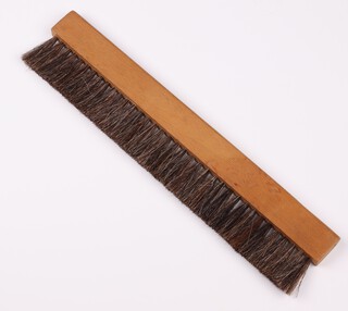 A beech and bristle draughtsman's dusting brush, 31cm w x 7cm h x 1.5cm d