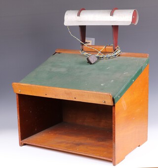 A plywood table top reading stand/lectern with metal and Bakelite lamp to the top, with green sponge inset surface above a recess, with original round pin plug 44cm h (67cm h inc light) x 54cm w x 42cm d 