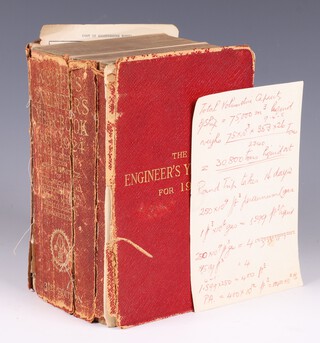 A piece of notepaper by Sir Barnes Wallis detailing calculations of airship fuel requirements for a 16 day round trip written in red ink with diagram verso, together with the 1924 Engineer Yearbook (split in half, loose boards and pages) within which it was found. 2905pp. 31st Edition. Yearbook signed  B.N. Wallis to first page