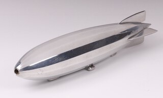 A chrome desk model/paperweight of an R.100 airship 20cm l x 4cm w, together with 2 volumes of Aircraft Engineering, February 1930 and June 1930, both with Department of Aeronautical Research & Development British Aircraft Corporation Ltd, Weybridge Division stamp to the front. 
