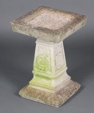 A well weathered square concrete garden  bird bath on a shaped column 50cm h x 36cm (in 2 sections)