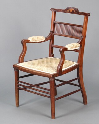 An Edwardian inlaid mahogany open arm chair with spindle back and upholstered seat, raised on turned supports 84cm h x 47cm w x 41cm d 