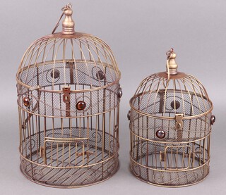 A circular, dome topped bird cage 41cm high x 26cm diameter, 1 other 32cm h x 21cm diam. 