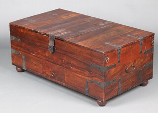 An Eastern hardwood coffer with hinged lid, the base fitted a long drawer 47cm h x 111cm w x 61cm d 