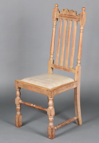 A bleached oak stick and rail back dining chair with upholstered drop in seat (missing a stretcher)
