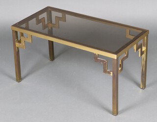 A mid-century rectangular gilt metal and plate glass coffee table 40cm h x 76cm w x 38cm d 