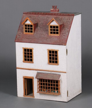 A child's doll house 69cm h x 47cm w x 31cm d  