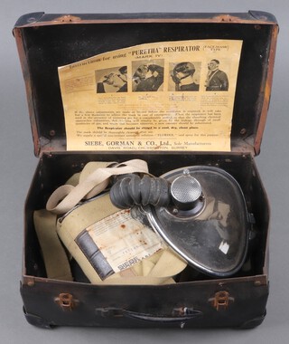 A Siebe Gorman Puretha Mk4 respirator with instructions, contained in a fibre case 