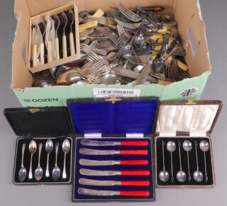A quantity of silver plated flatware (in a cardboard box) 