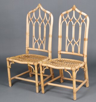 A pair of bamboo high backed chairs 