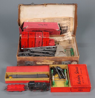 A collection of early Hornby clockwork O gauge vehicles and track to include LNER 826 locomotive, an unboxed Castrol oil wagon complete with 4 barrels, an unboxed open trailer, open wagon, a boxed lumber vehicle, Prats petrol wagon, no.1 milk traffic van, no.0 refrigerator van, a brake van, no.1 buffer stocks and level crossing no.1, together with a box of curved rails 

