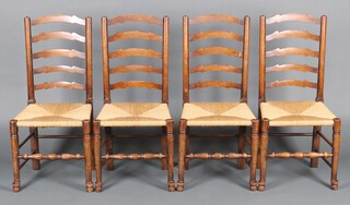 A set of 4 elm ladder back dining chairs with woven rush seats 