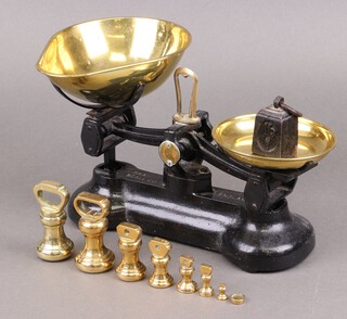 A pair of Libra domestic iron pan scales with brass pans and weights