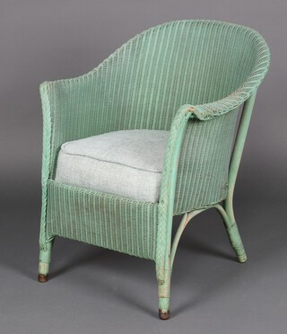 A green Lloyd loom chair with sprung cushion 