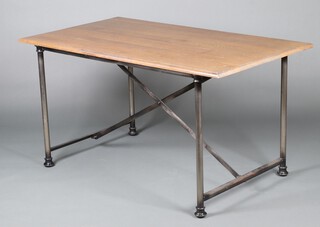 An oak and metal framed rectangular table raised on column supports 79cm h x 149cm l x 83cm w 