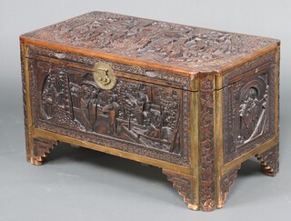 A carved camphor coffer with hinged lid 55cm h x 99cm w x 54cm d (small section of timber missing to back left edge) 