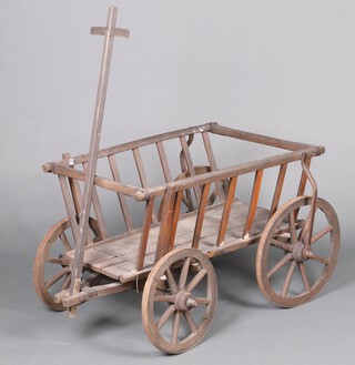 A North European wooden hand cart with cast iron shot wheels 62cm h x 89cm w x 59cm d