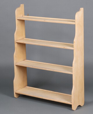 A pine 4 tier bookcase 102cm h x 76cm w x 23cm d 