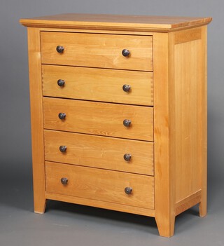 A light oak chest of 5 drawers 114cm h x 93cm w x 47cm d 