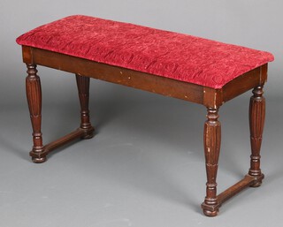 A rectangular beech duet stool with upholstered hinged lid, raised on turned supports 50cm h x 90cm w x 37cm d 