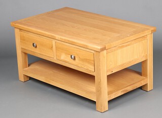 A rectangular light oak 2 tier coffee table fitted 2 drawers 50cm h x 100cm w x 60cm d 